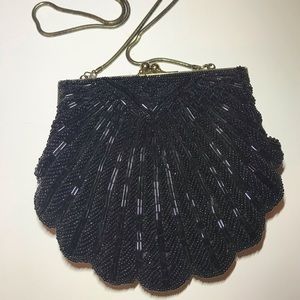 Beaded clam shell clutch with slinky strap nice !